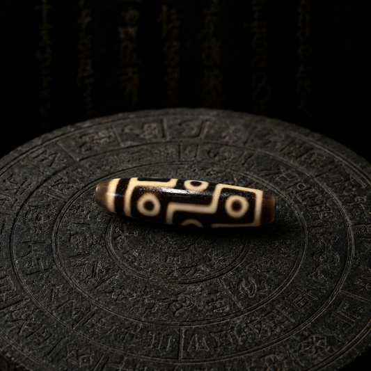 Nine-Eye Dzi bead meaning and symbolic Himalayan presence